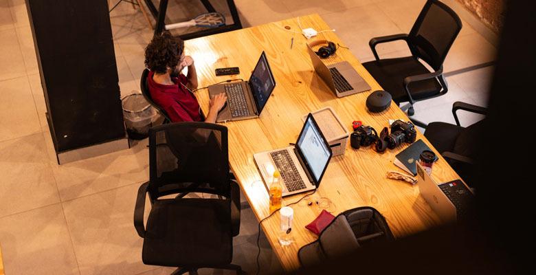 Engineers working together at desks in a managed co-working space