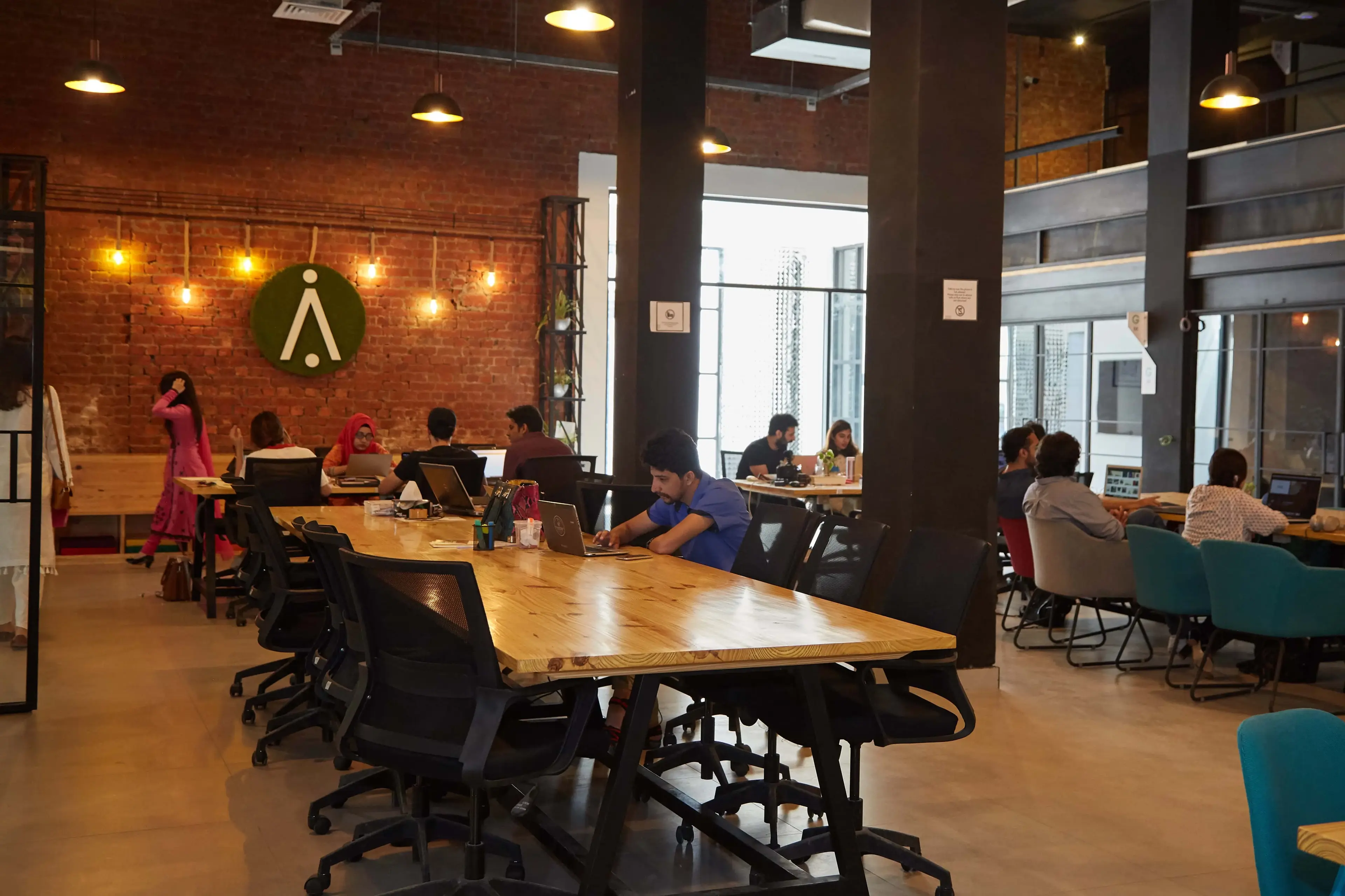 People working in a premium co-working space DigiNeom manages
